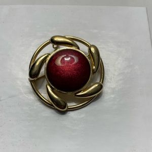 Gold tone red enameled pin